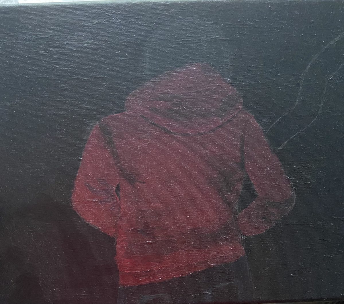 Person wearing red hoodie facing away from the viewer.