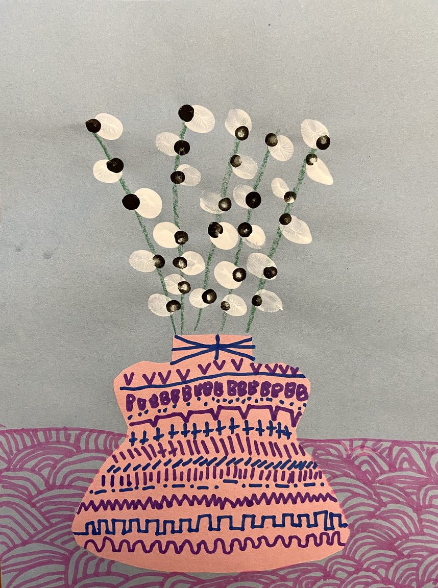 White flowers in a pink patterned vase