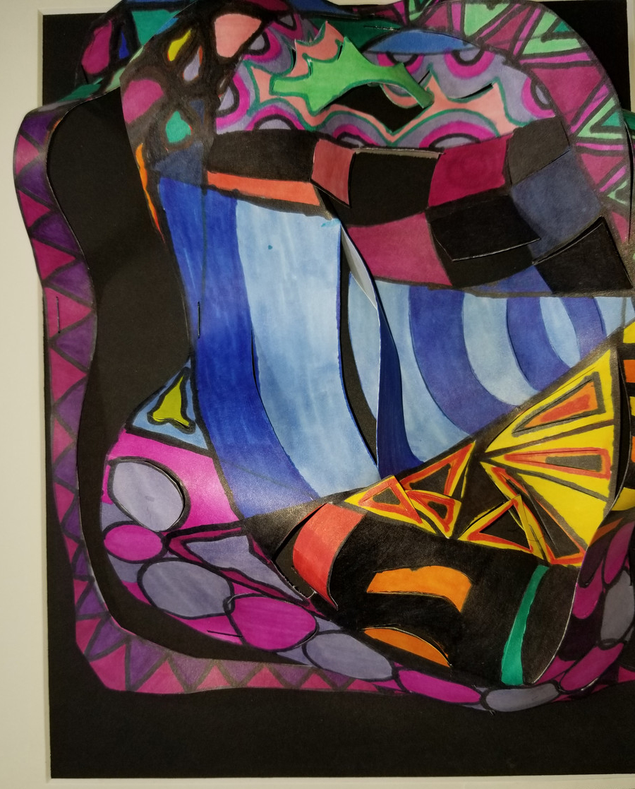 Abstract design of lines and shapes on cut paper.