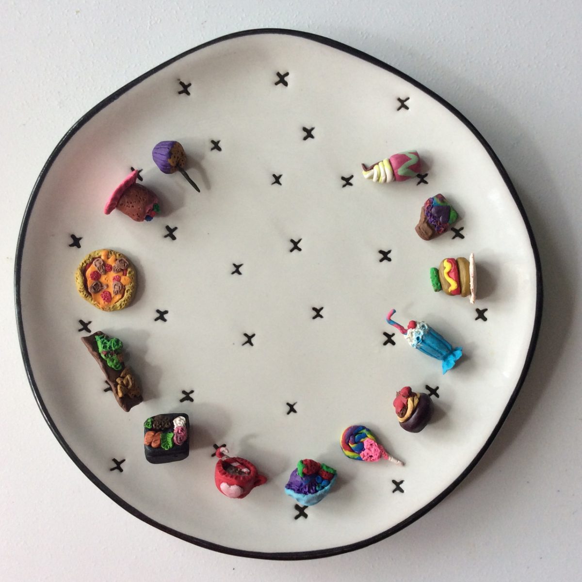 Clay sculptures on a salad plate