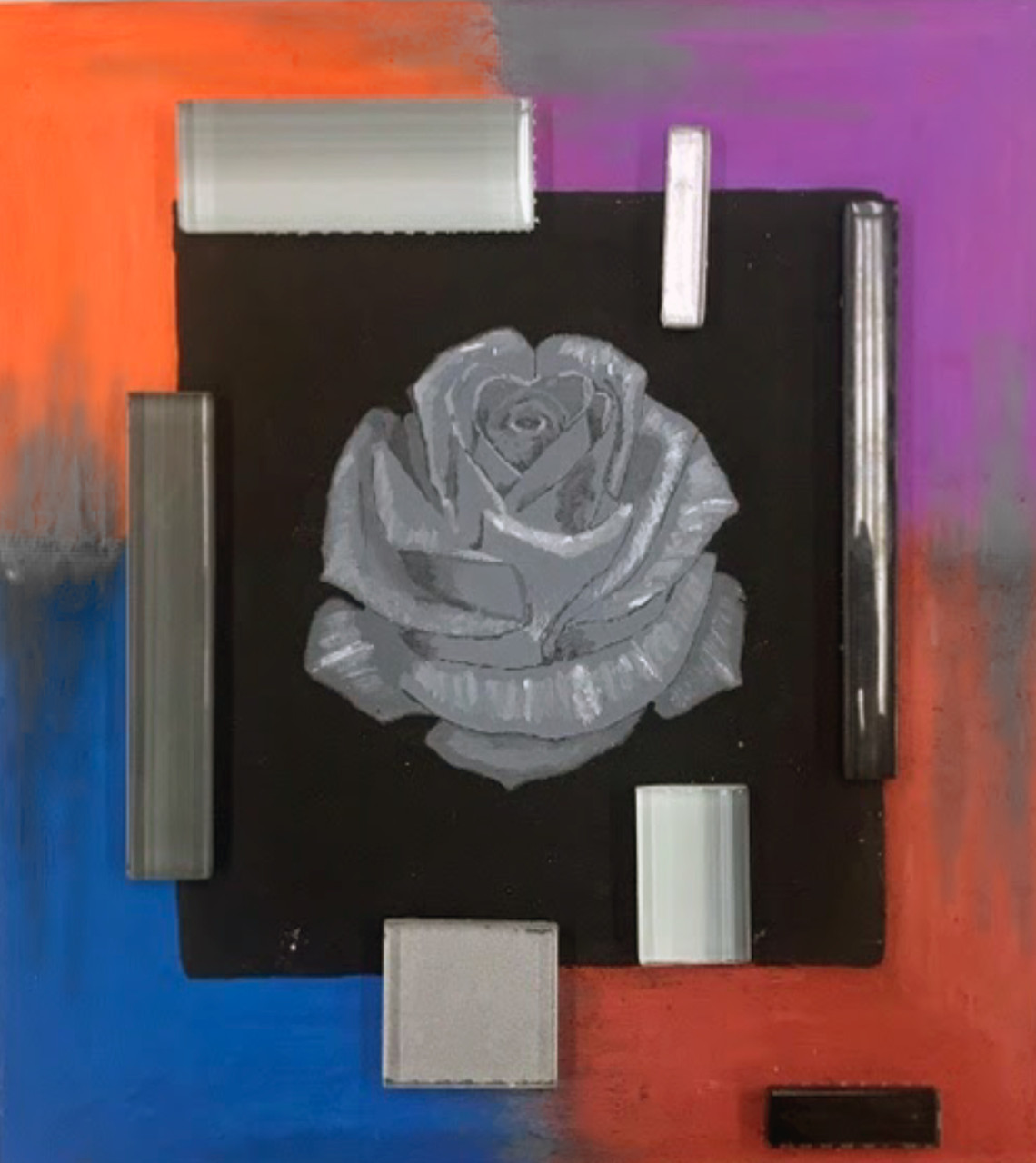 White rose on black background surrounded by silver rectangles and an orange, purple, blue, and red border