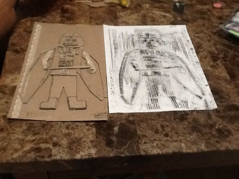 Darth Vader of cardboard and a rubbing made of the paper Vader