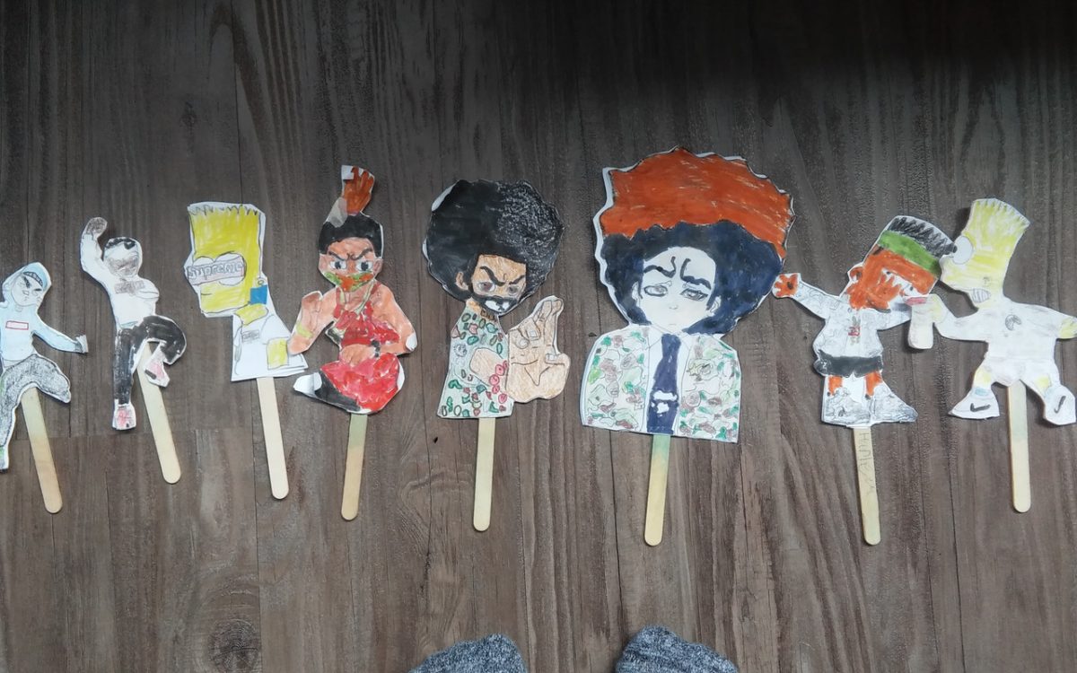 Cut out characters on popsicle sticks
