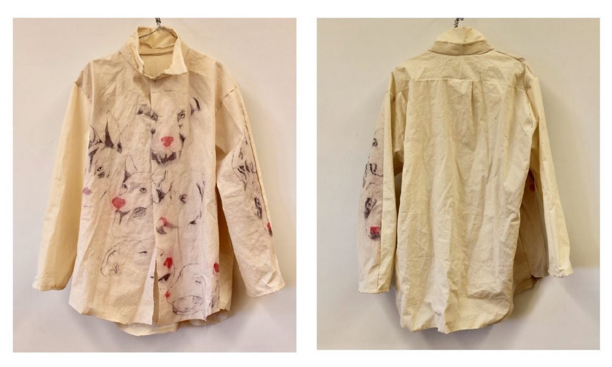 Yellow button up shirt with figures of dogs painted on the front and side arm