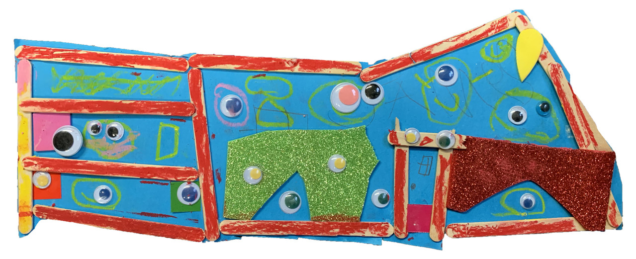 Red painted popsicle sticks and green sparkle foam on a blue background with googly eyes.