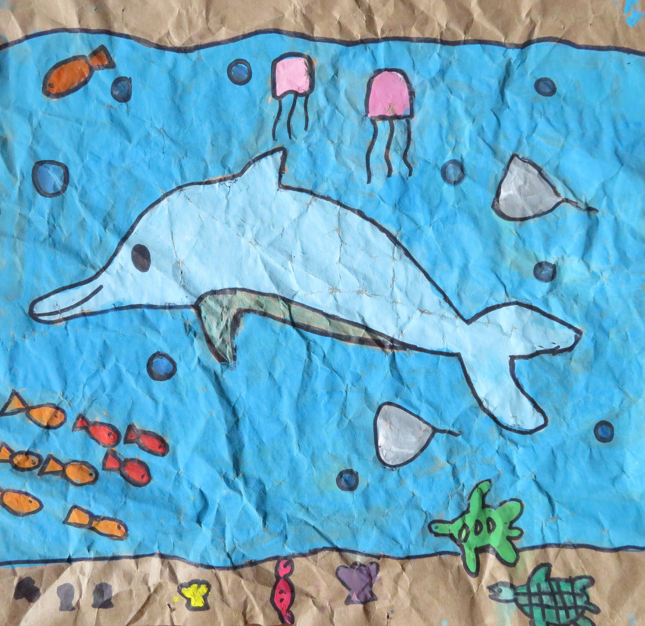 Painting of dolphin and other sea creatures