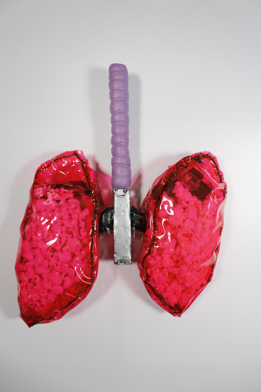Pair of lungs with popcorn and juul pods inside