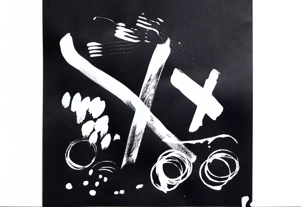 White brush strokes on a black background