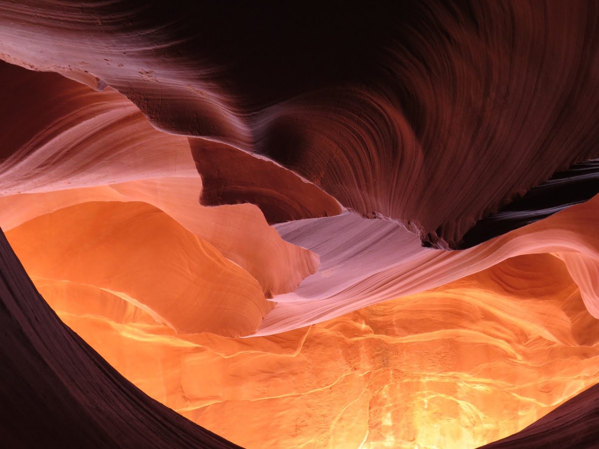 Photograph of orange hued rock formations.