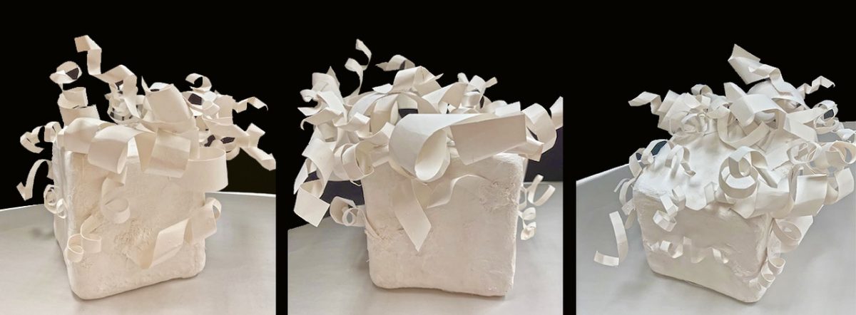 Three white boxes with curly shapes coming out of the tops.