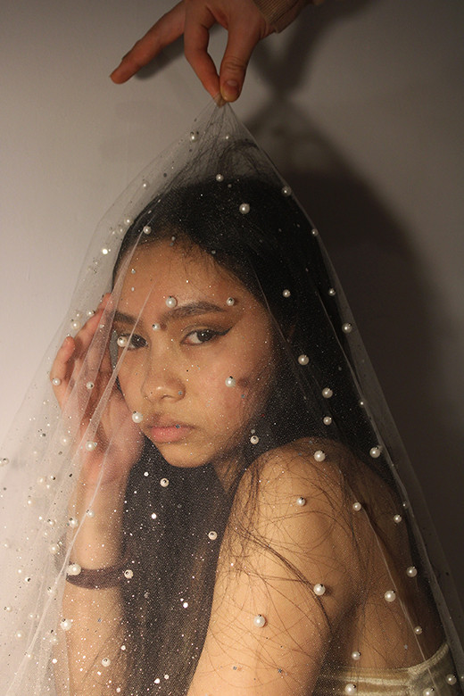 Photo of girl with veil over her face