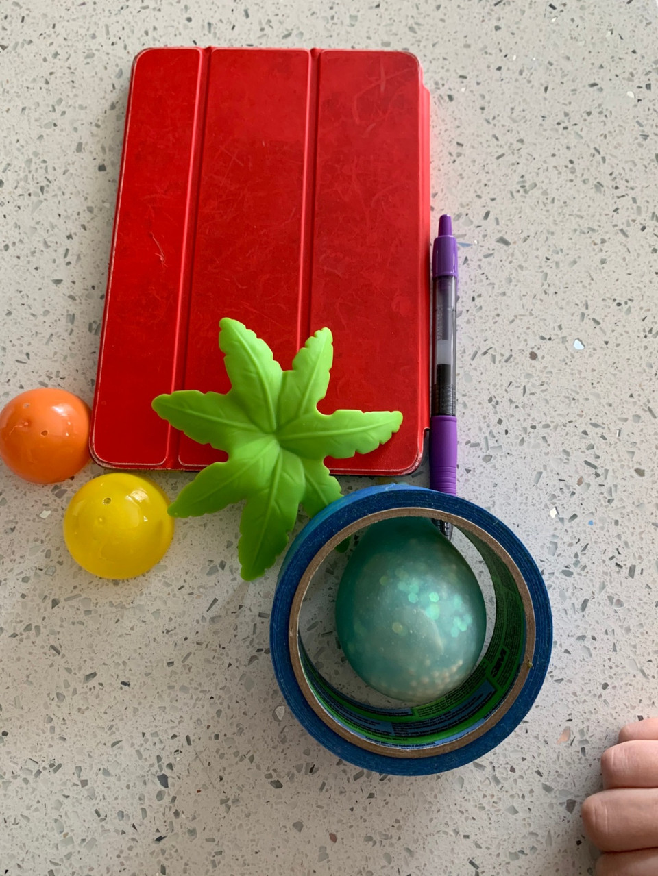 Group of objects in red, orange, yell, green, blue, and purple.