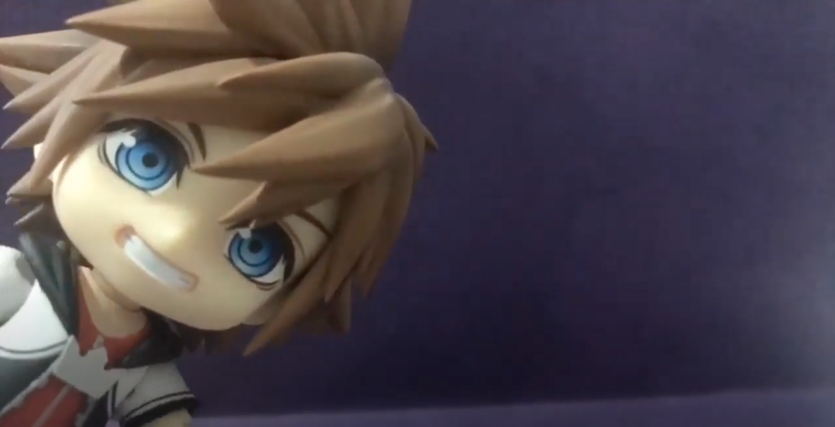 Toy child peeking into the left side of the frame