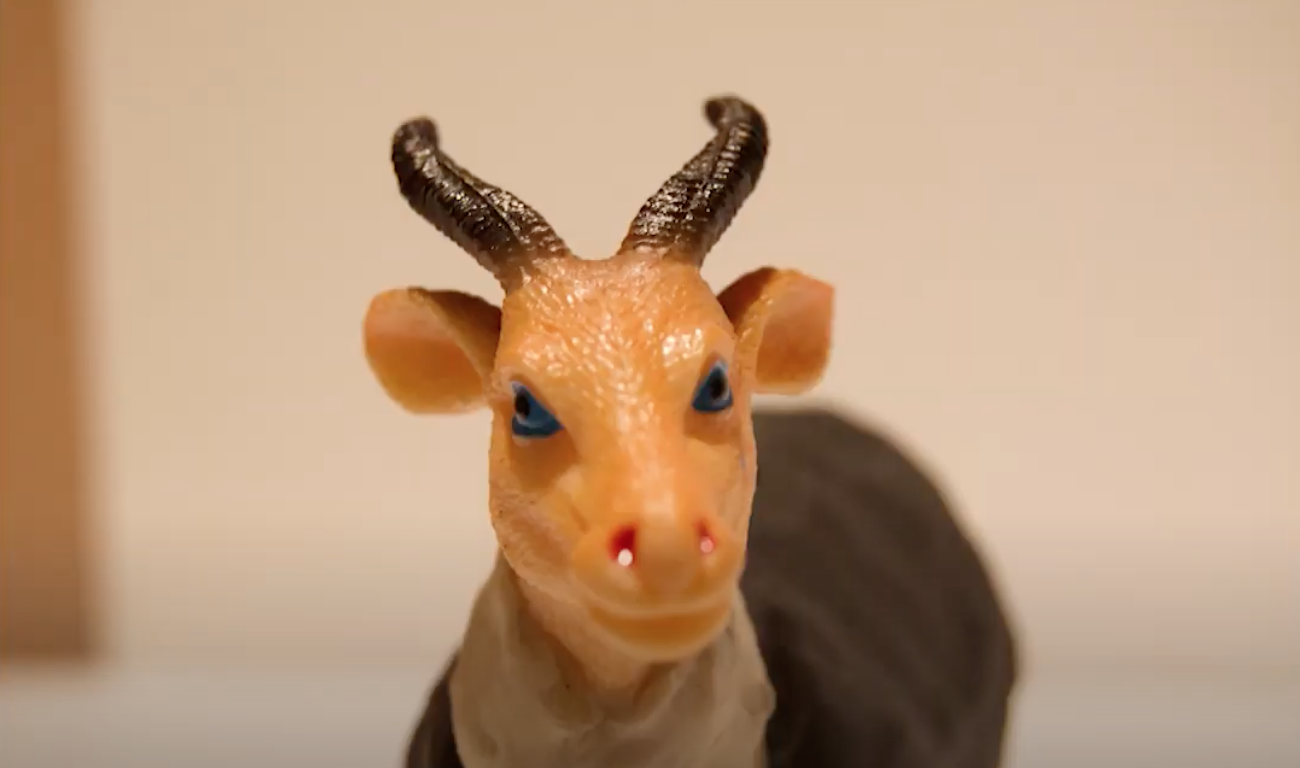 Toy ram with green eyes
