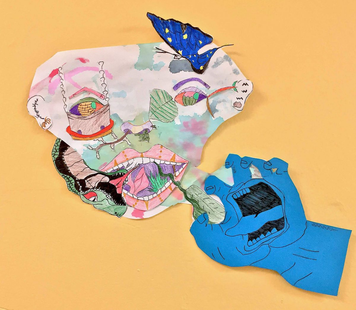 Cutout blue hand with a face