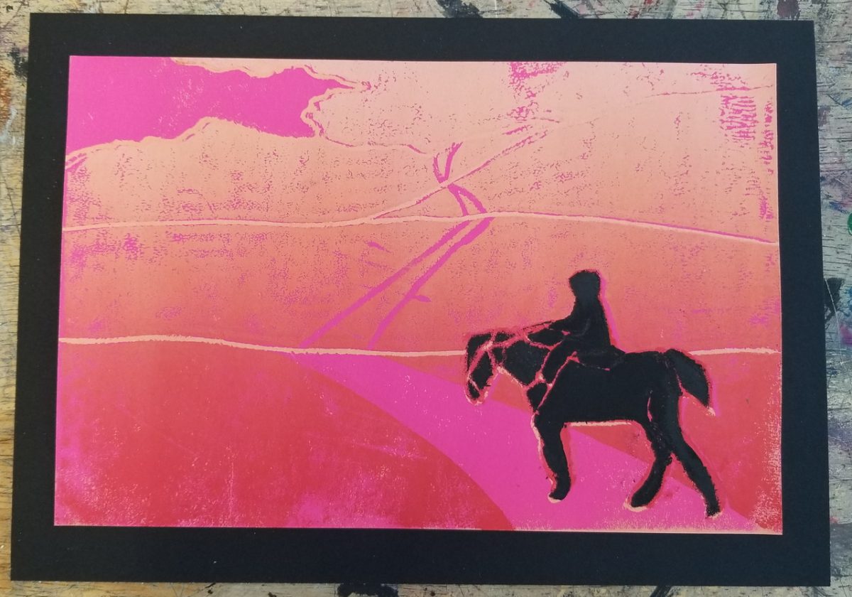 Silhouette of a person riding a horse on a pink and red background