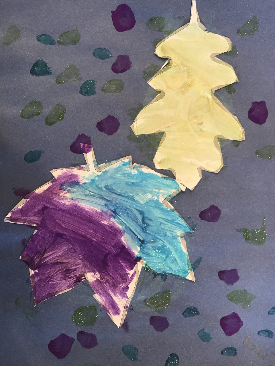 Yellow and purple/blue leaves on a blue background with green and purple dots.