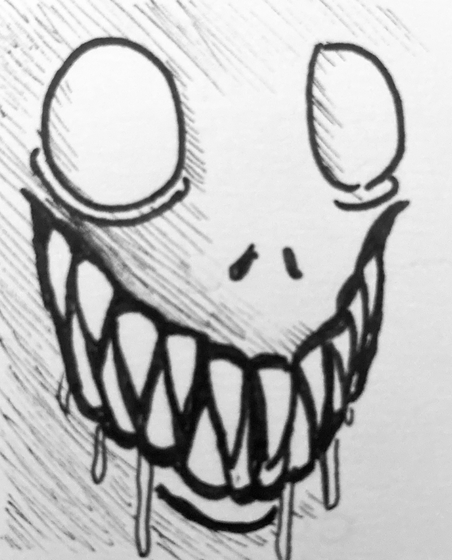 creature with large eyes and fangs
