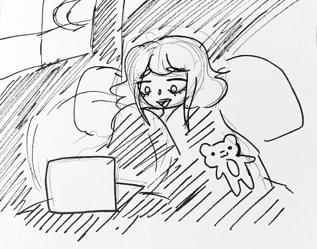 person reading a laptop with a teddy bear