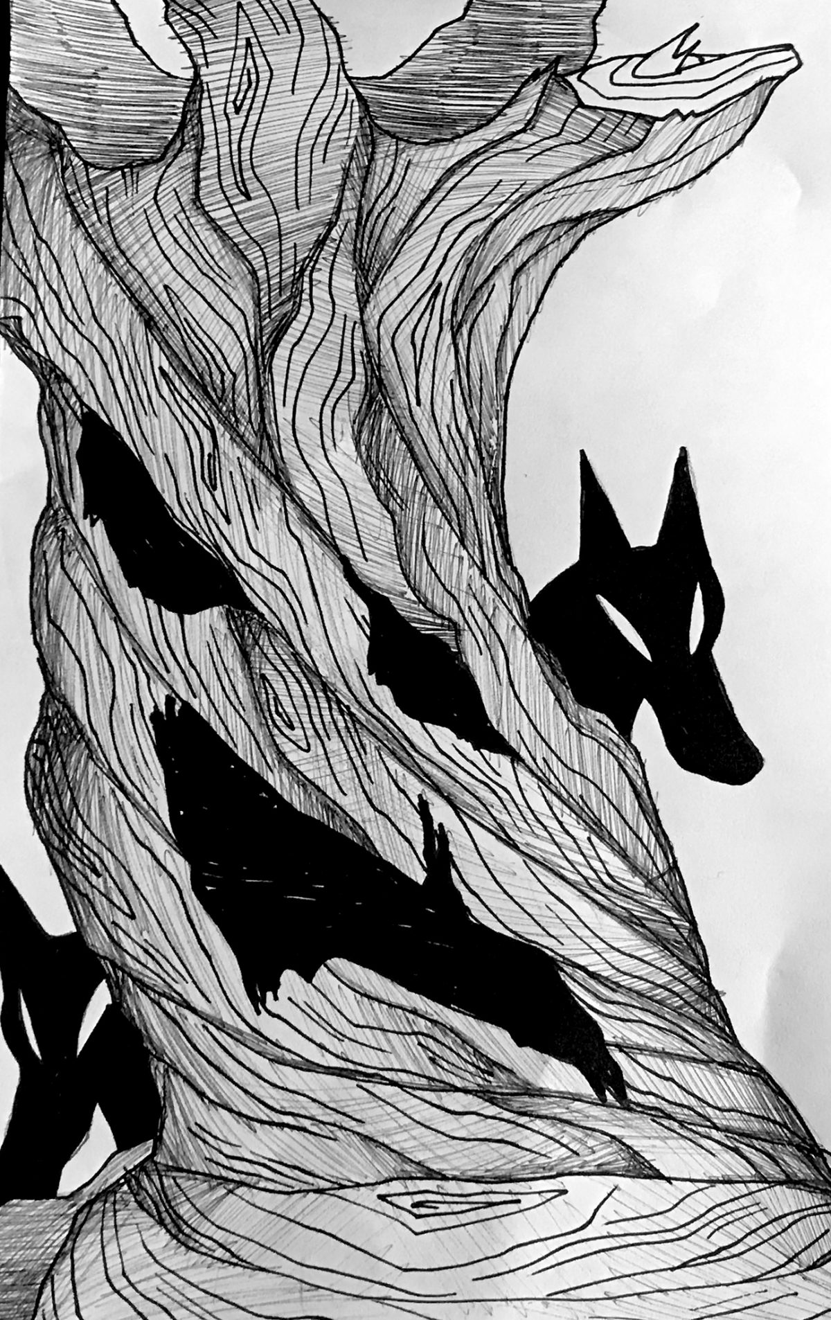 animal behind a spooky tree