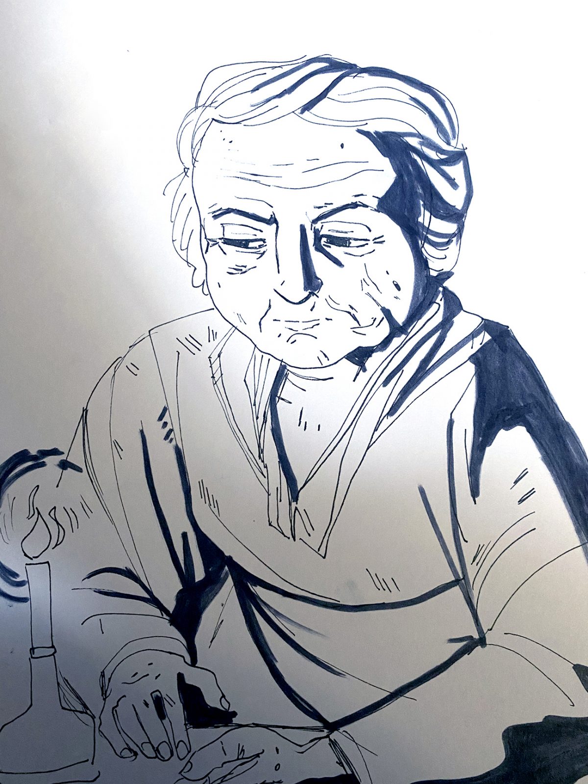 person looking at candle