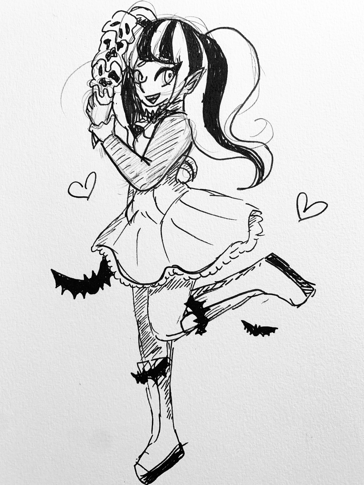 person holding skull ice cream cone with bats around their legs