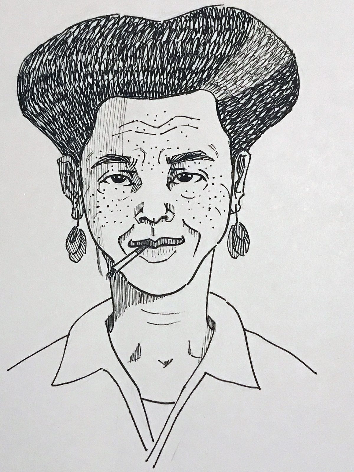 person with short hair, earrings, and a cigarette