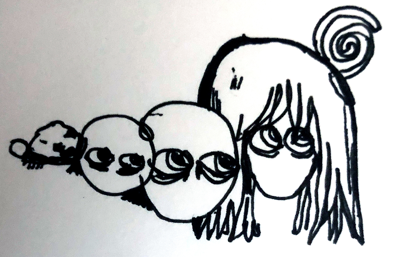 3 faces next to a rock