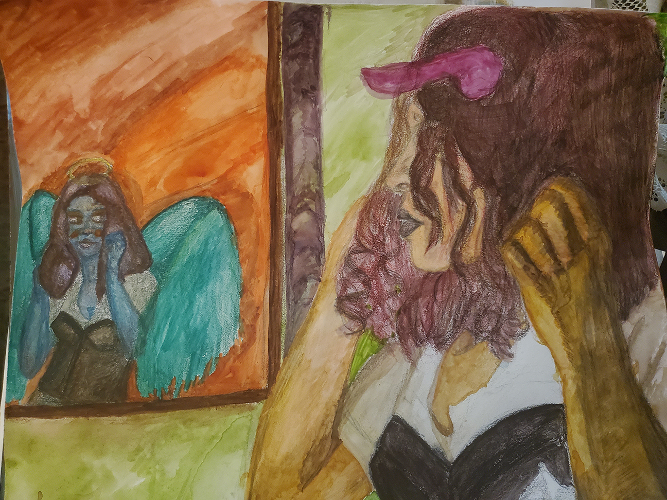 person looking at a painting of an angel