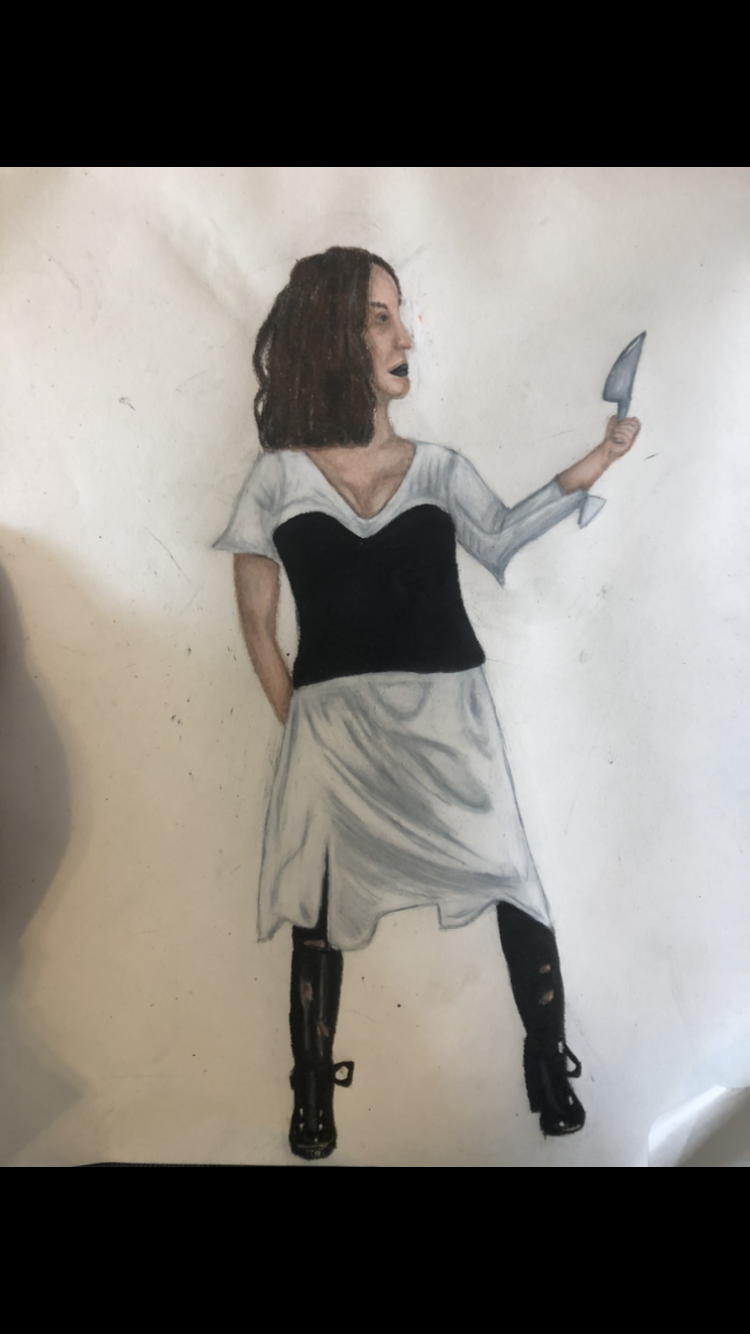 person in black and white dress holding a knife