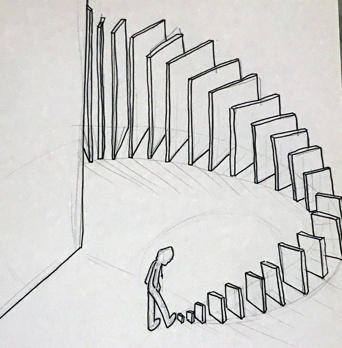 person kicking out a row of dominoes