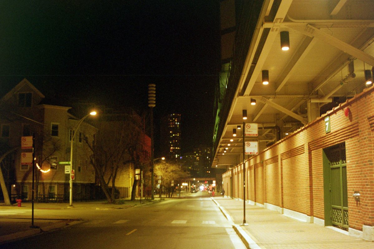 Photograph of Waveland Ave. by Wrigley Field at night.