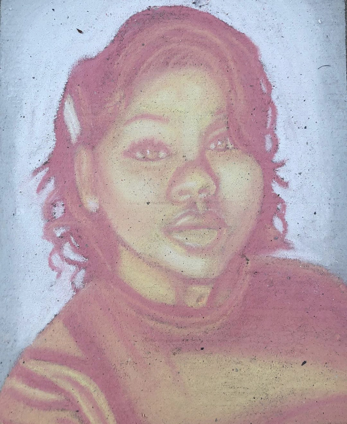 Chalk drawing of Breonna Taylor in a red sweater with blue background