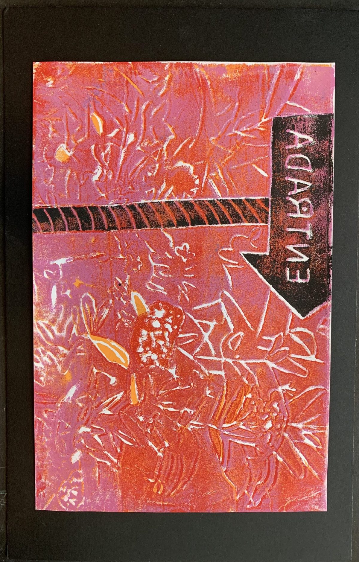 Geometric etchings of white and yellow against a background of reds and browns.