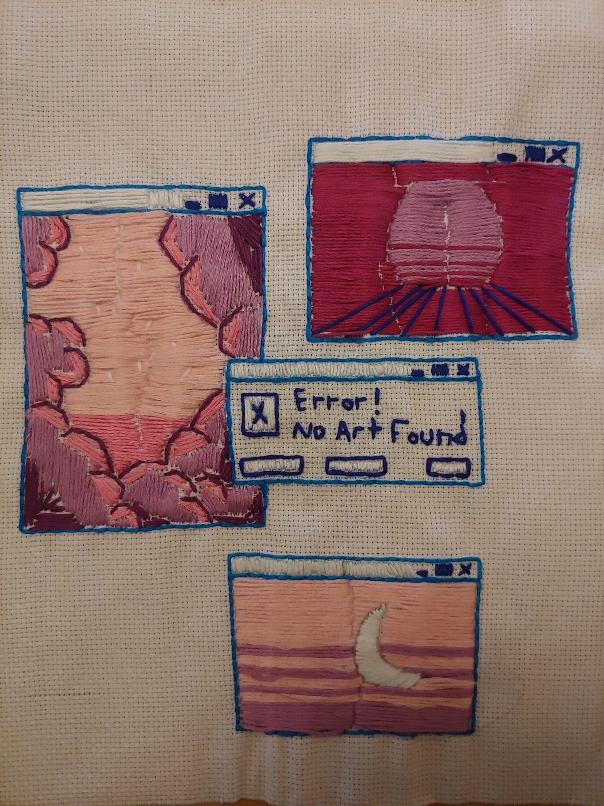 Embroidery of 4 computer windows, 3 with landscapes and 1 that reads "Error! Art Not Found."
