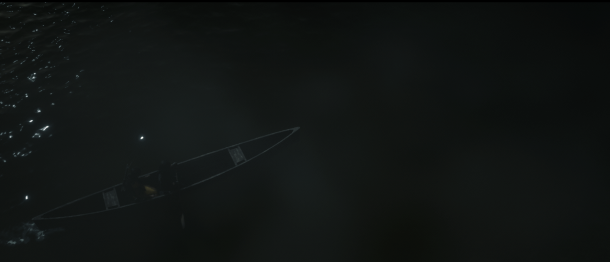 View from above of two people in a canoe at night with fog