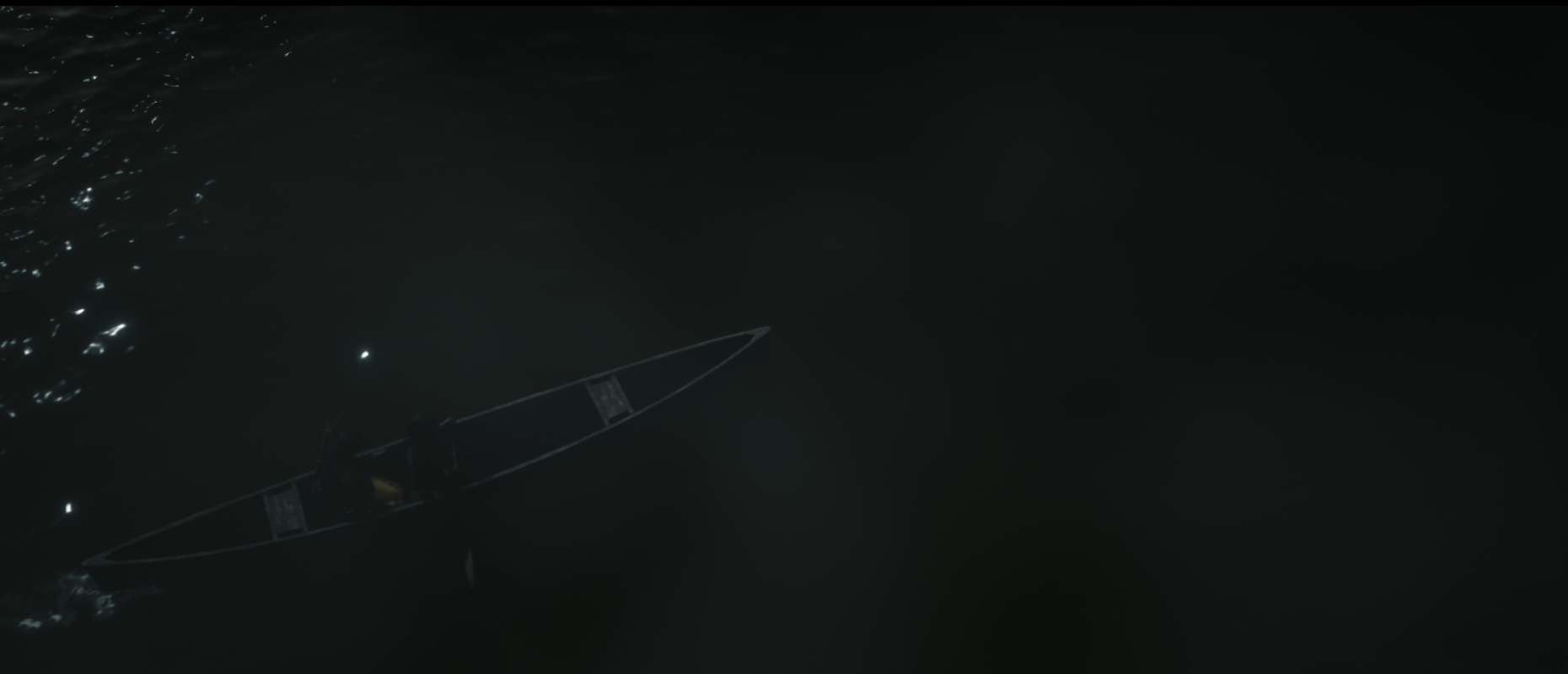 View from above of two people in a canoe at night with fog