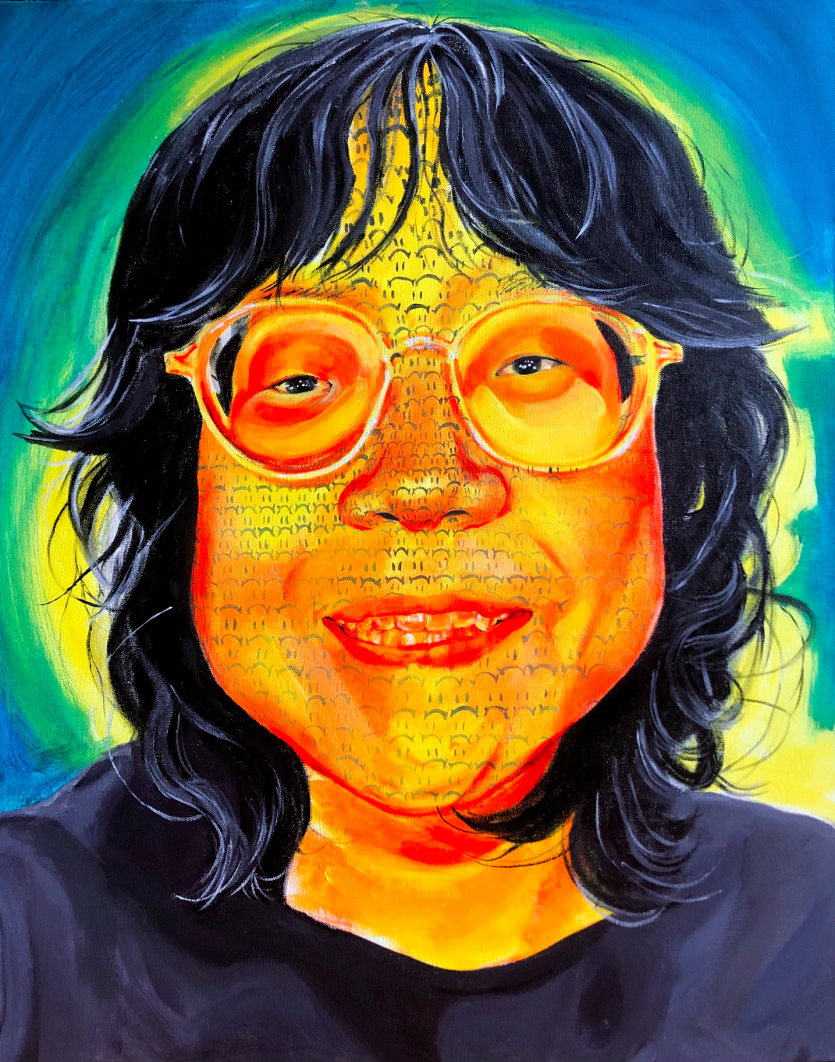 Portrait of person with dark, shoulder length hair wearing glasses