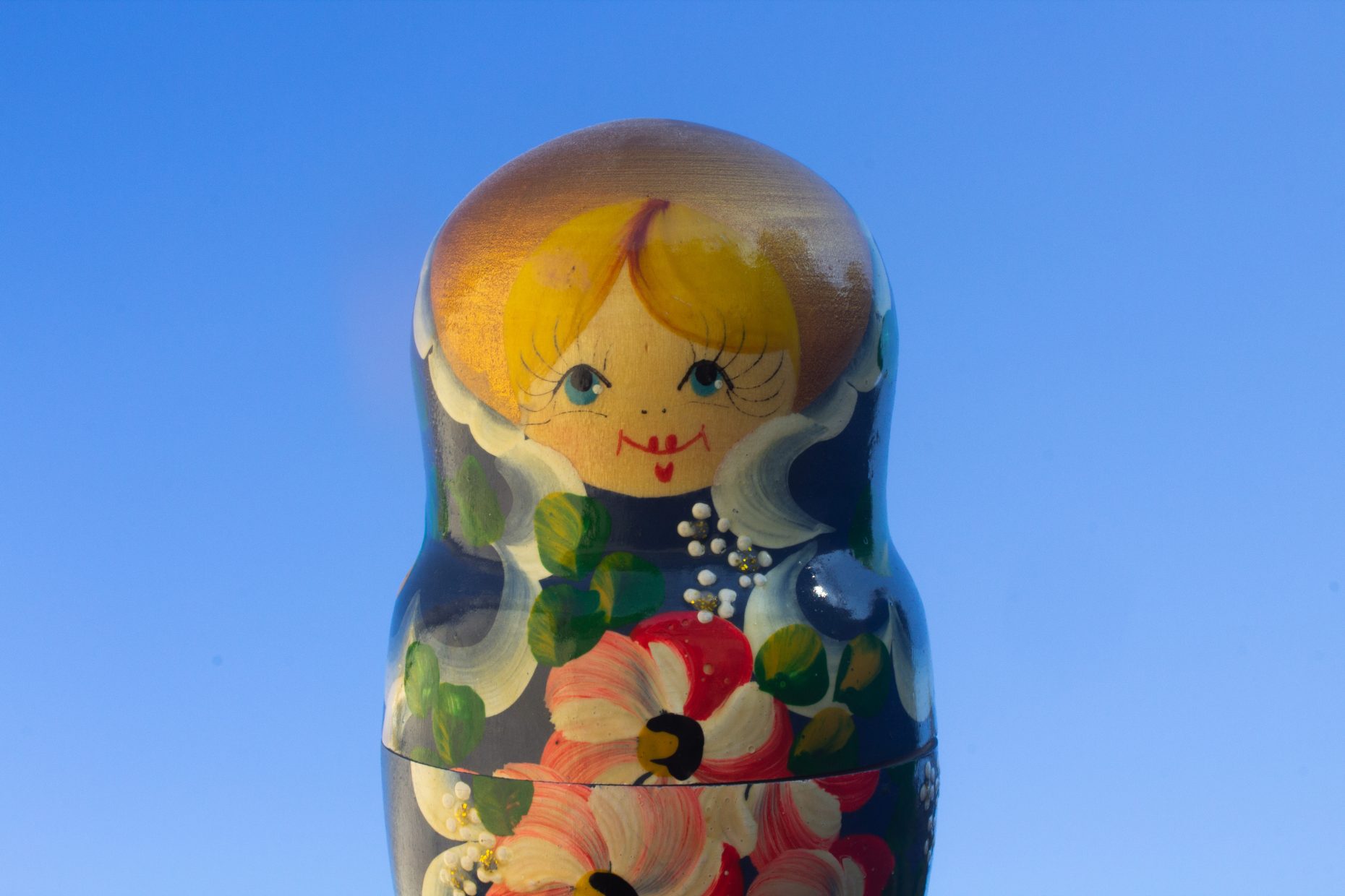 Photograph of a matryoshka (nesting) doll on a blue background