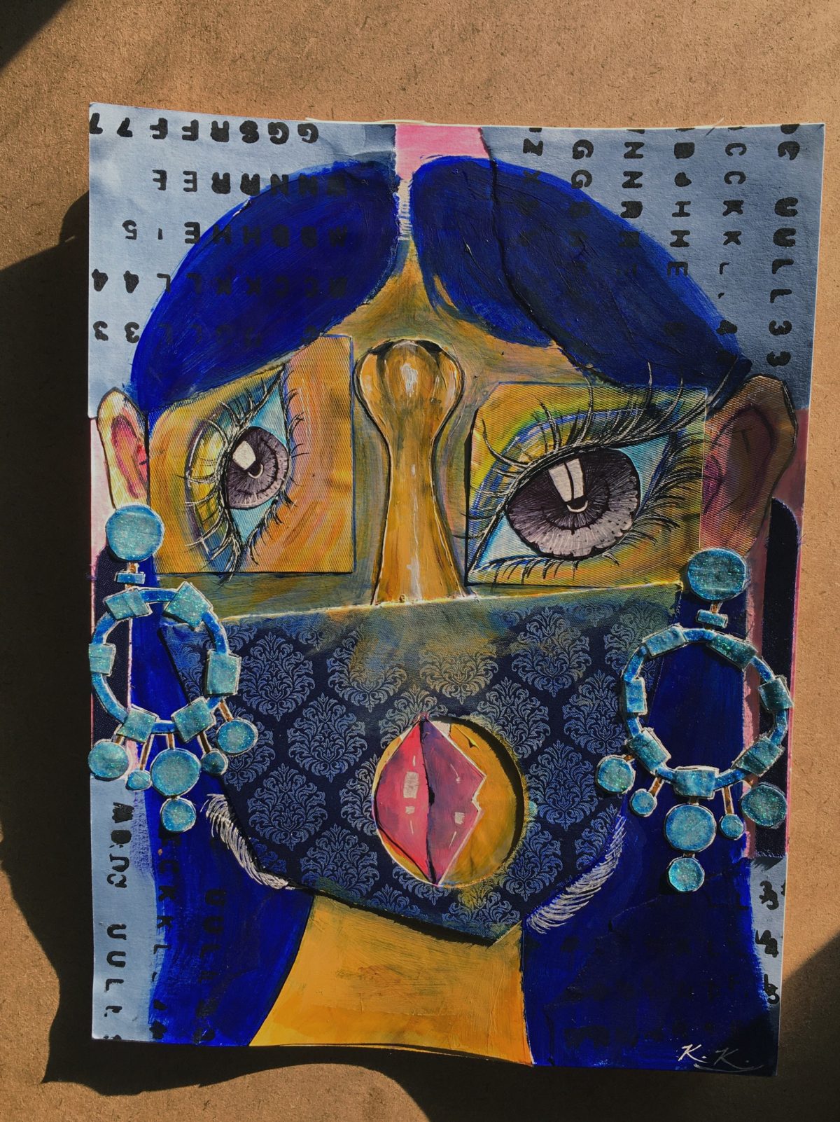 Cubist painting of a face in blues, purples and silver with mask and earrings; eyes and mouth rotated.