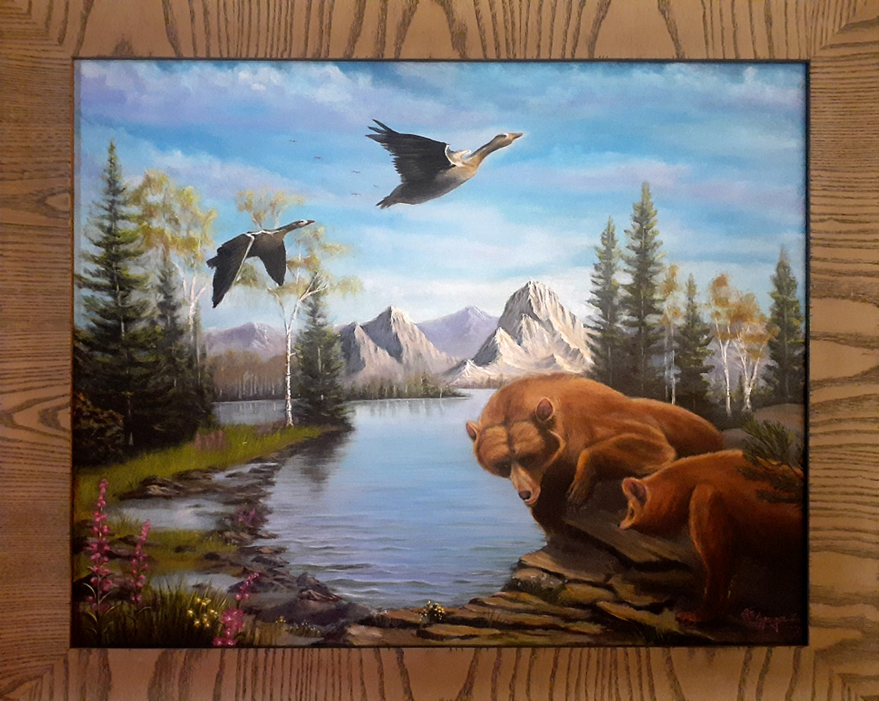 Bears and geese near a mountain lake.