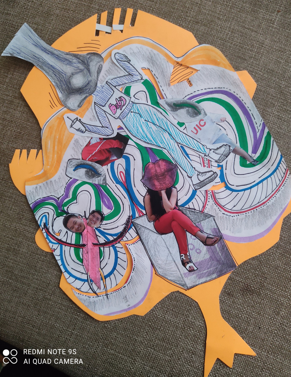 Collage on an orange piece of paper, body parts and swirly lines