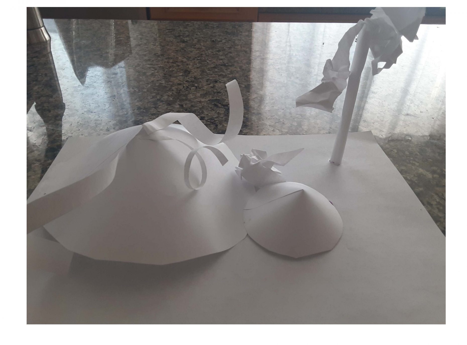 Paper sculpture of a mountain and volcano