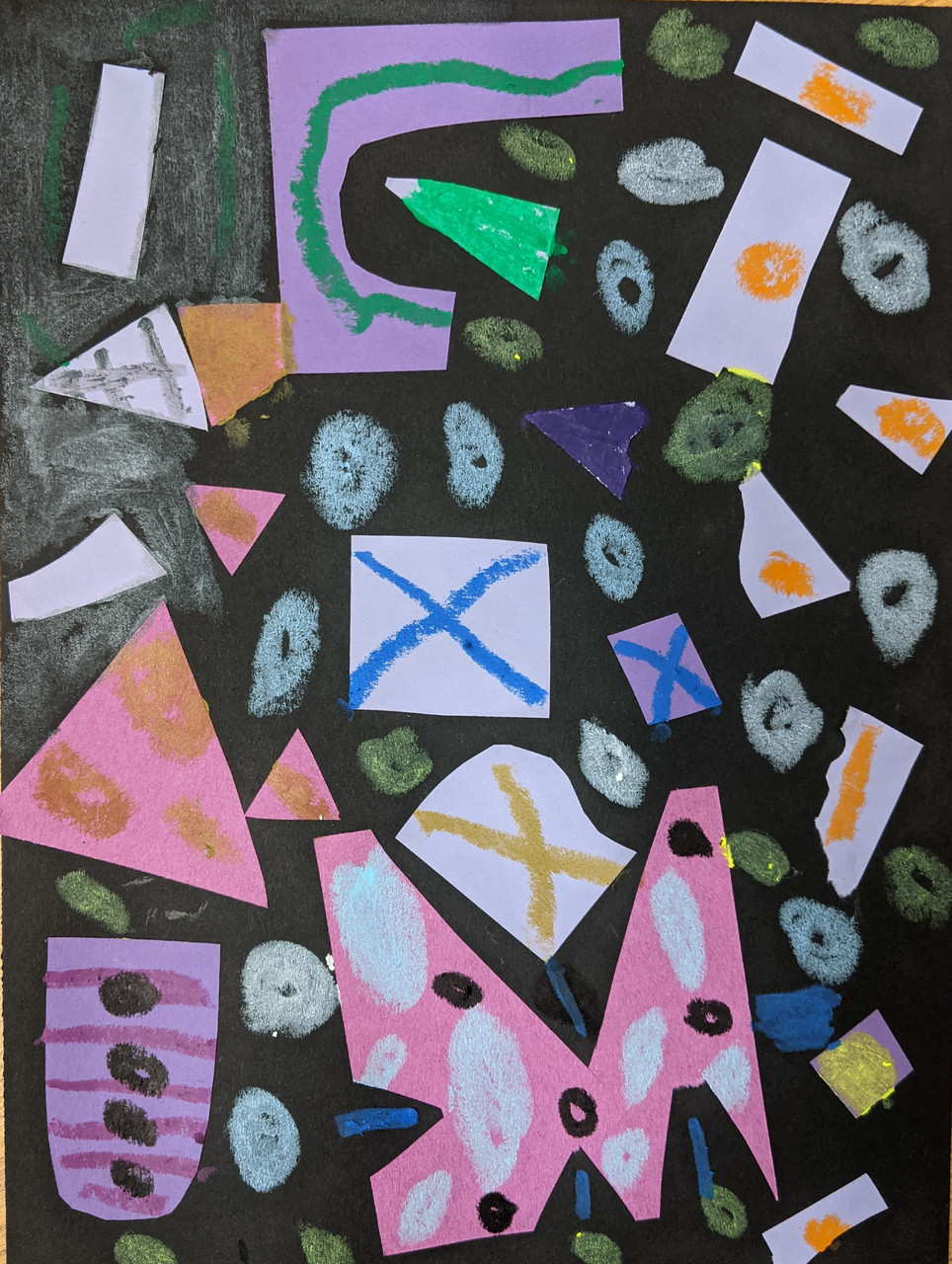 Cut and colorful shapes on a black background