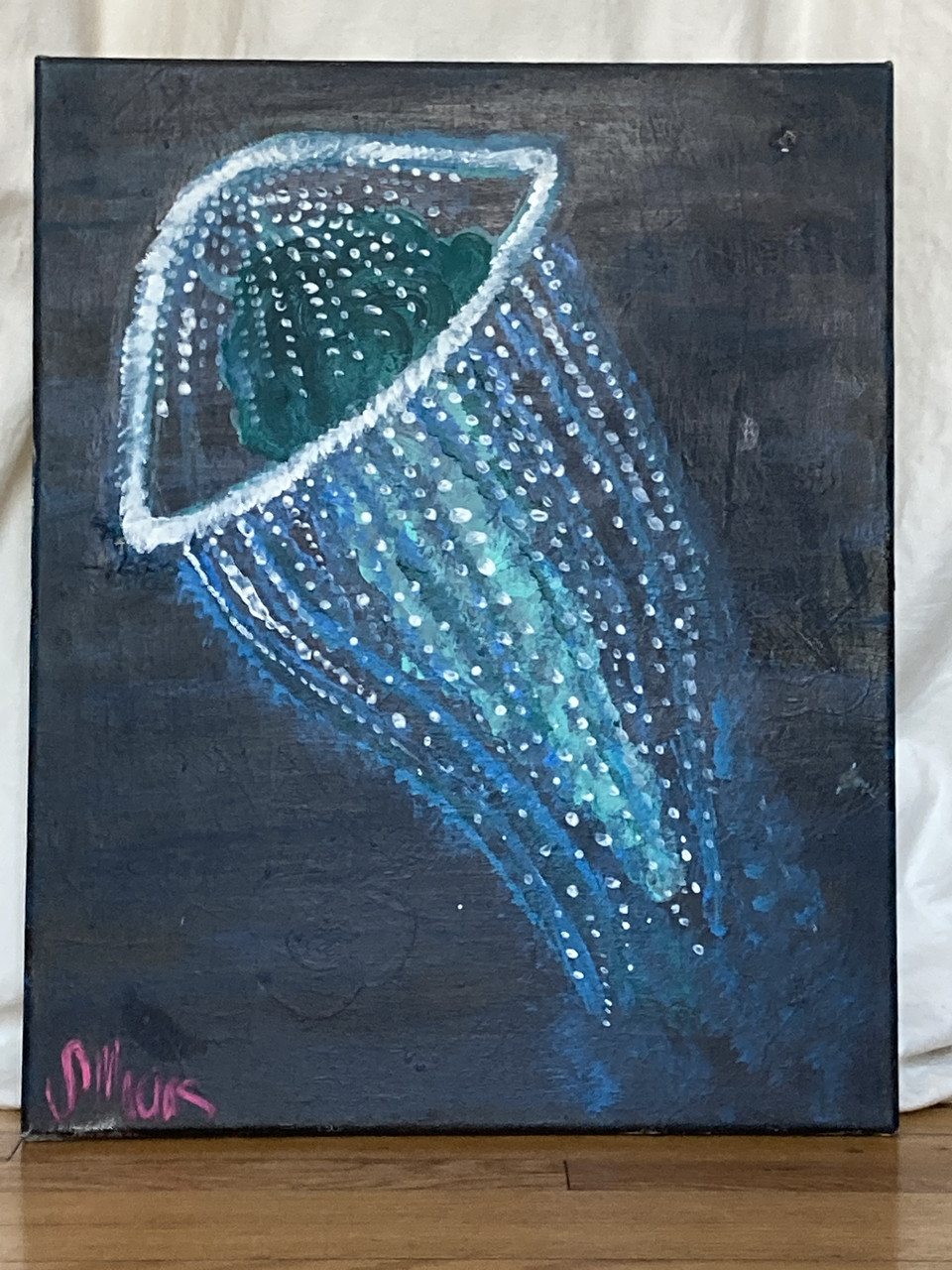 White and blue jellyfish on a black background
