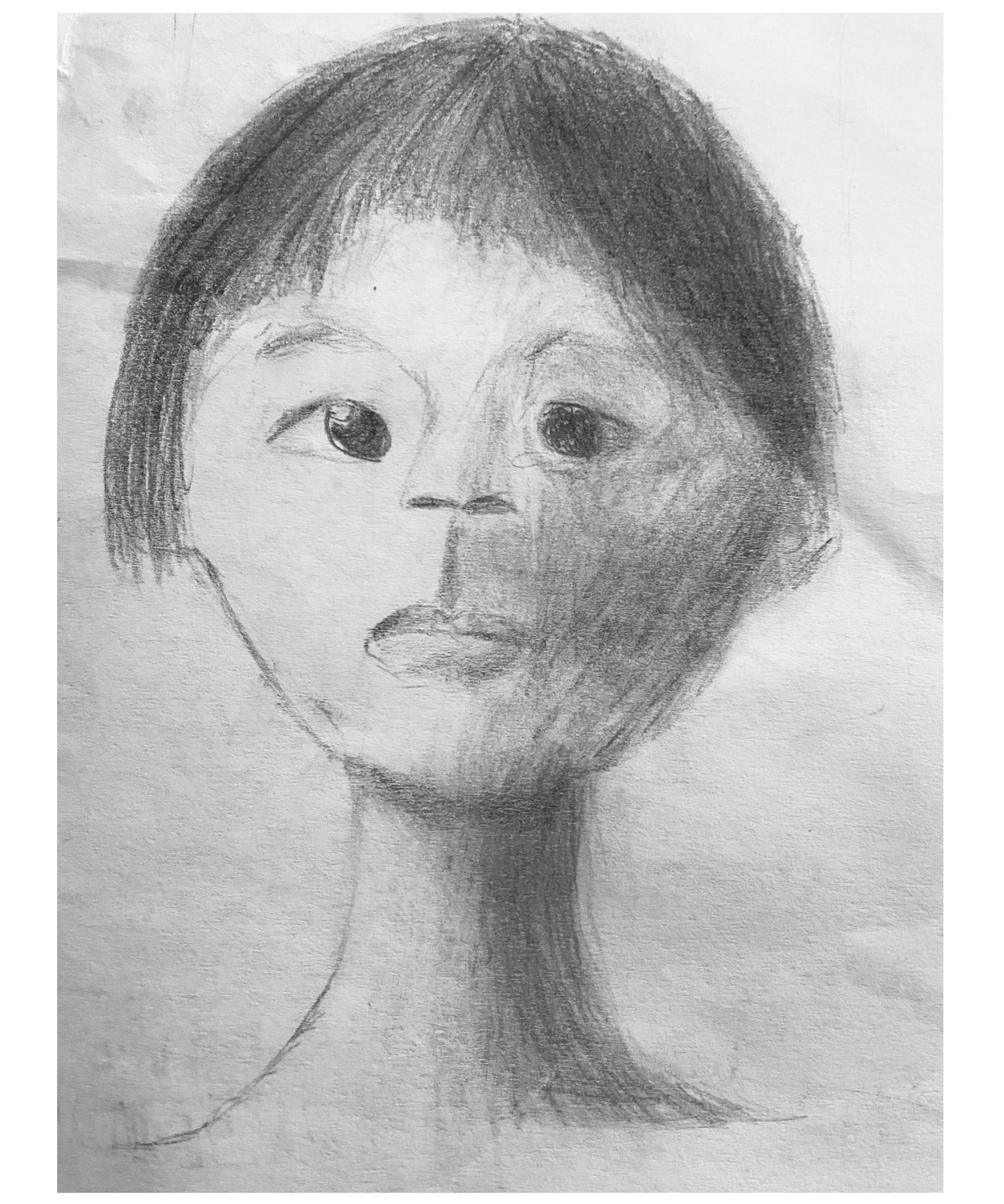 Graphite drawing of a person's face with short hair