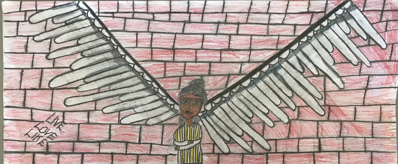 drawing of person in front of wings painted on brick wall