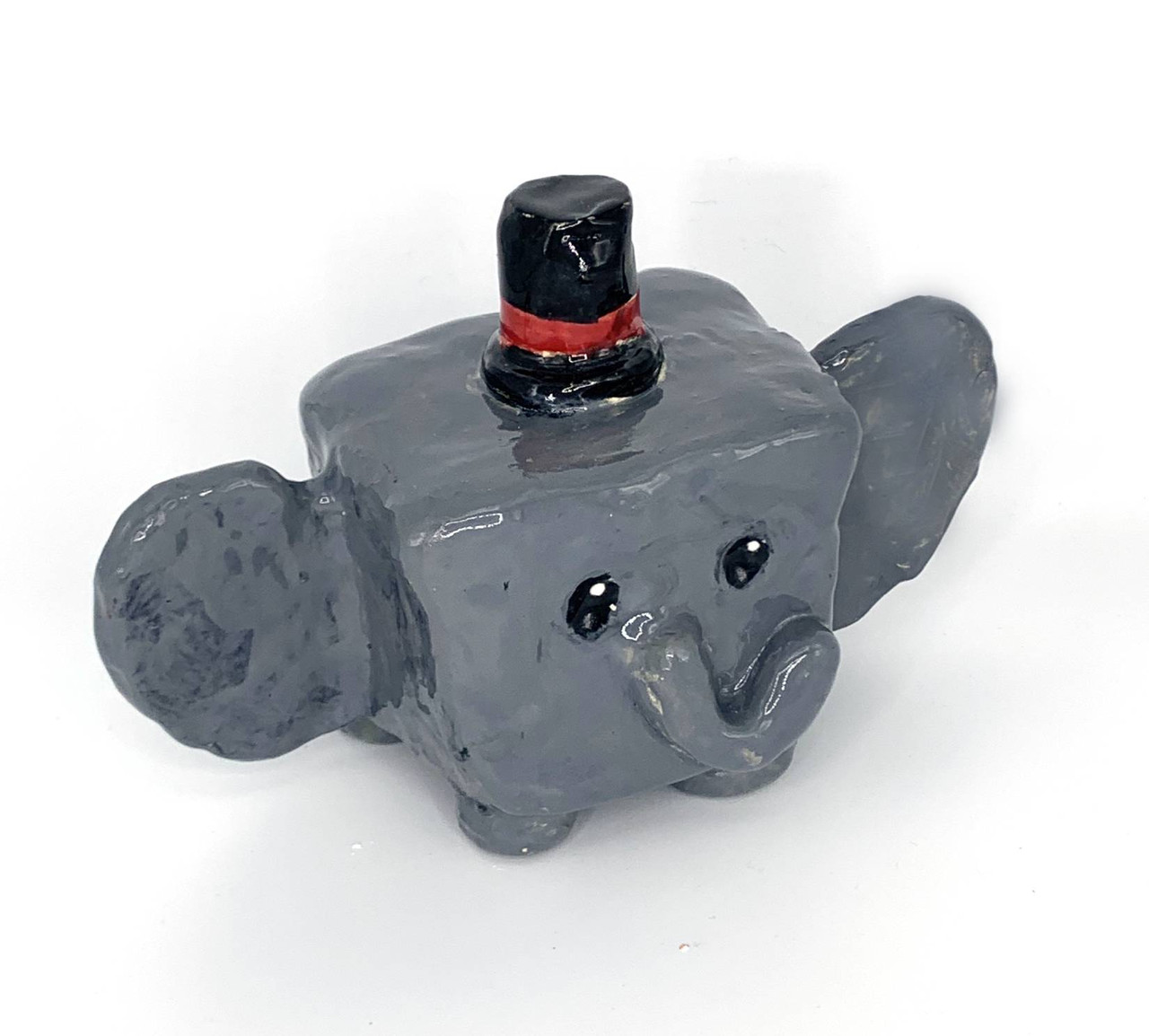 An elephant head made out of clay