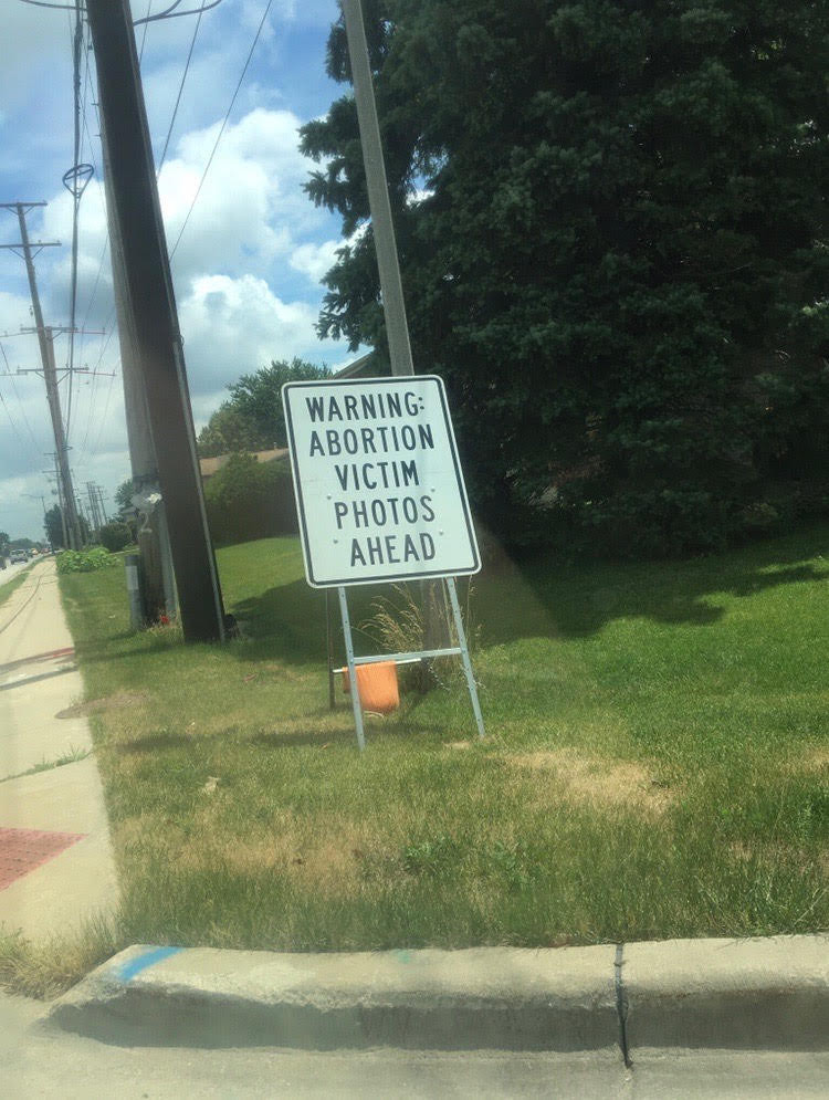 Picture of a sign that says "Warning: Abortion Victim Photos Ahead"