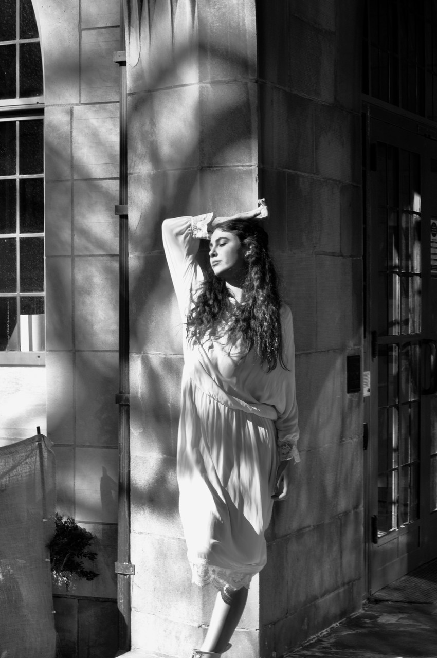 Black and white photo of woman in white dress